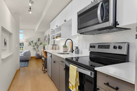 a kitchen with a stove and a microwave