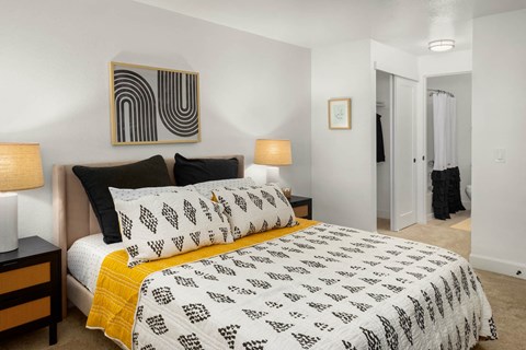 a bedroom with a bed and two night stands