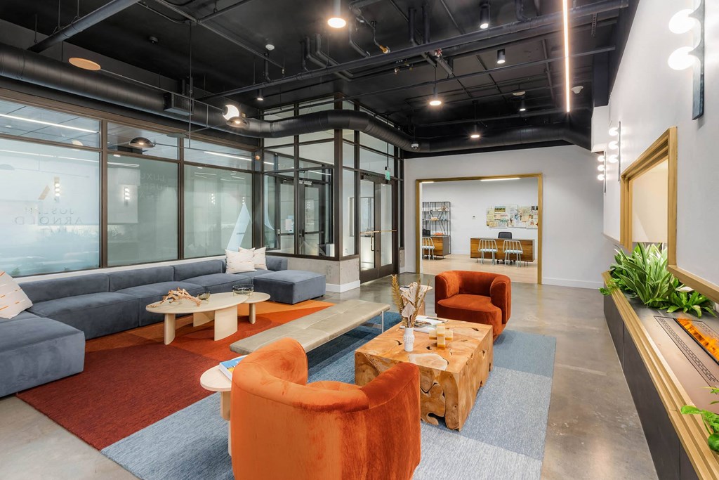 a living room with couches and chairs and a table