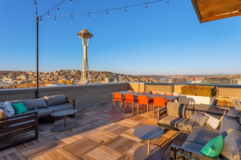 a rooftop patio with a view of the stratosphere tower and the space needle