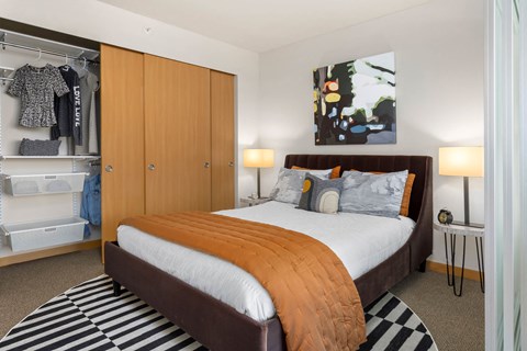 a bedroom with a bed and a closet