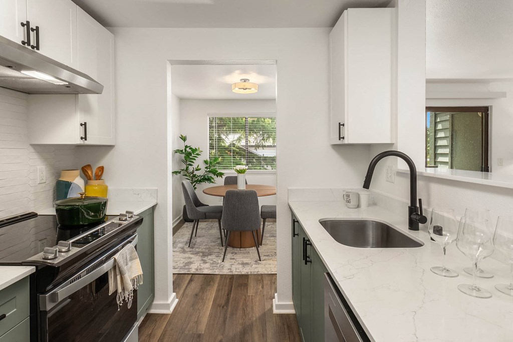 a kitchen and dining area in a 555 waverly unit