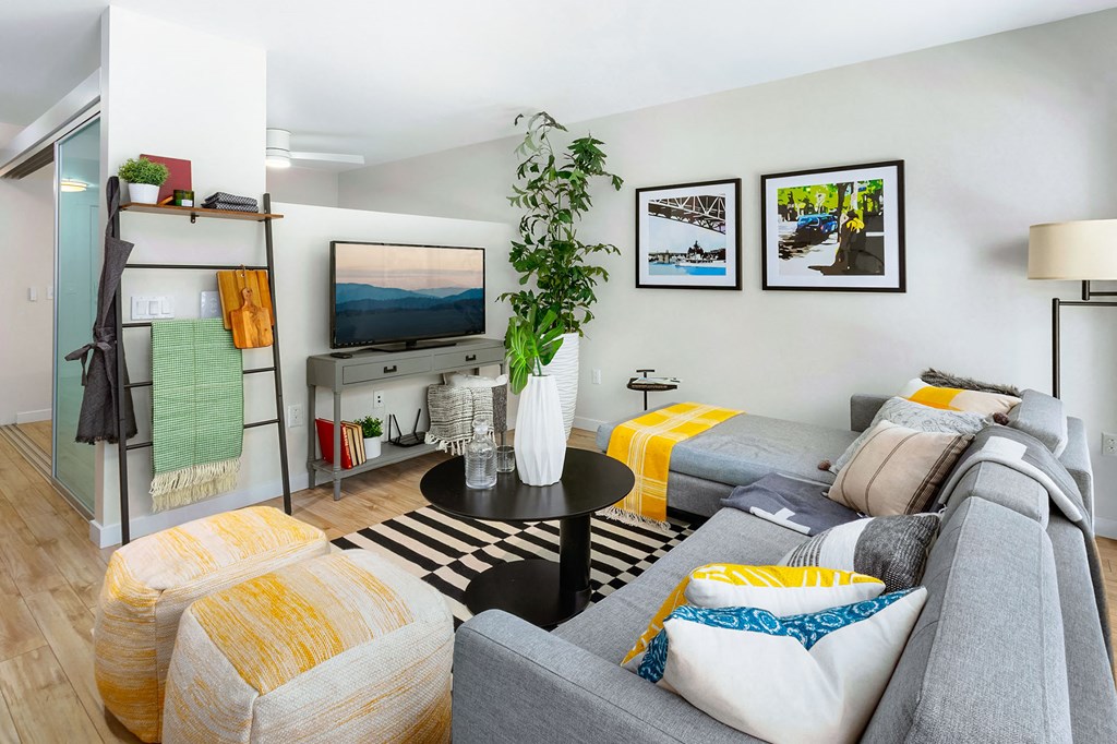 a living room with a couch and a tv