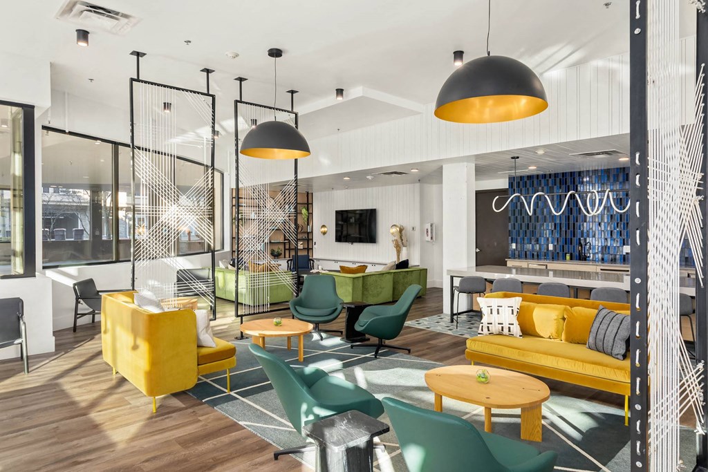 a room filled with furniture and a large window