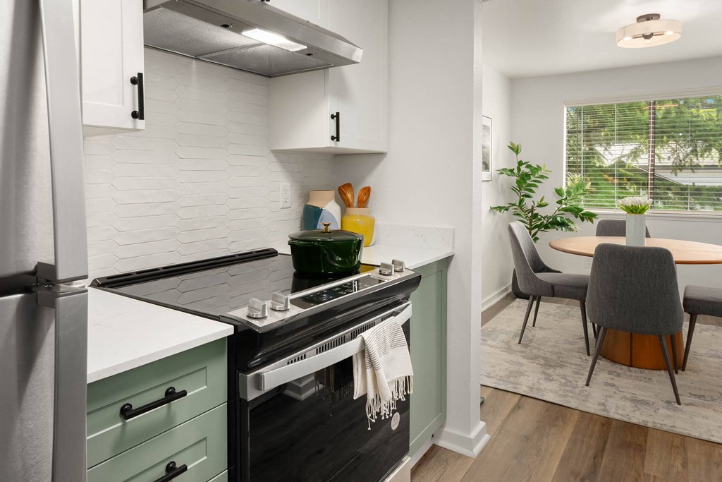 a kitchen and dining area in a 555 waverly unit
