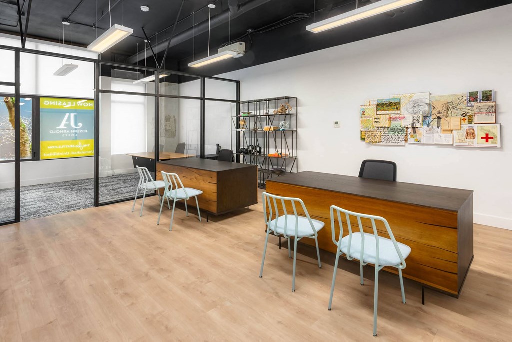 a conference room with a wooden table and chairs