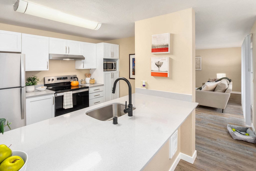 a kitchen with a large counter top and a sink