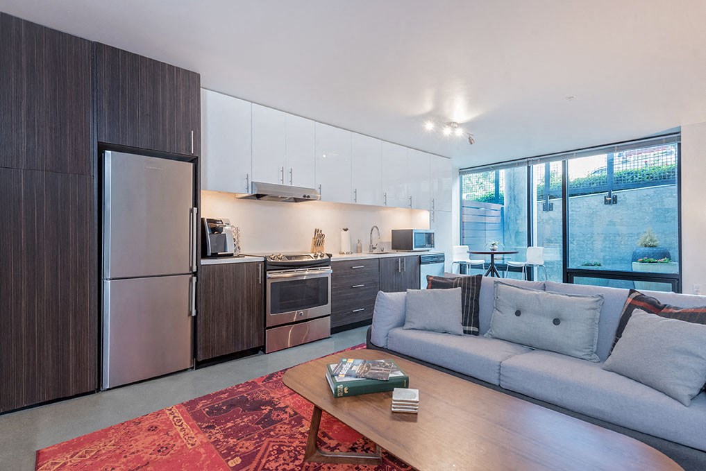 a living room with a couch and a table