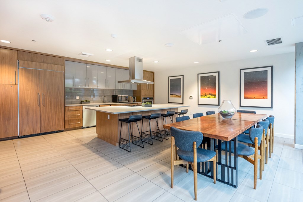 a large kitchen and dining room with a wooden table and chairs