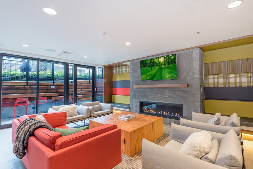 a living room with couches and a fireplace