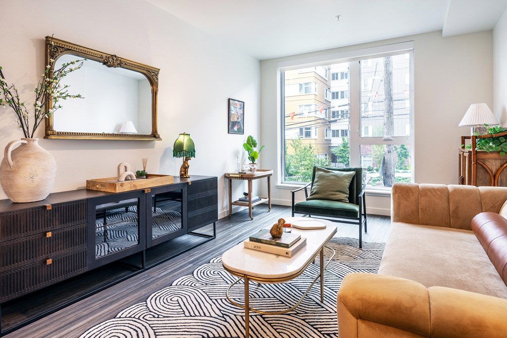 a living room with a large window and a couch