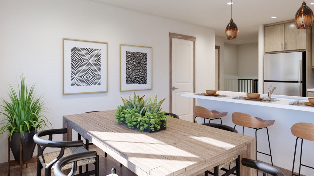 a dining room with a wooden table and chairs