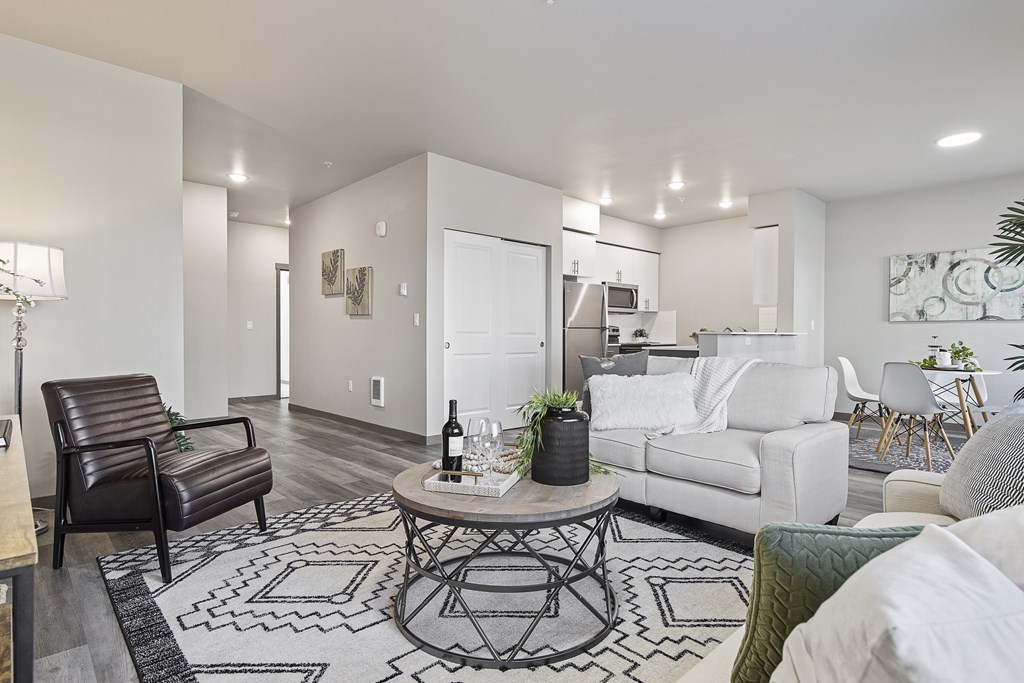 A living room with a white couch and a coffee table.