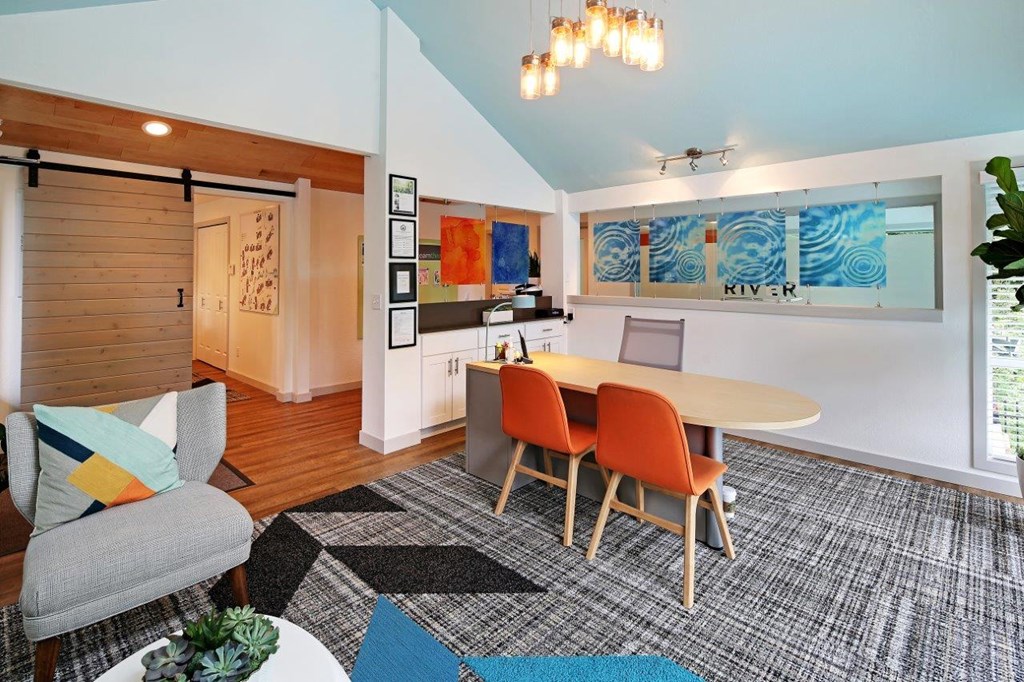 a dining room with a table and chairs