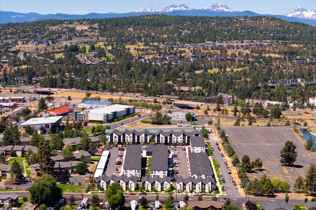 A large building with a parking lot in front of it.