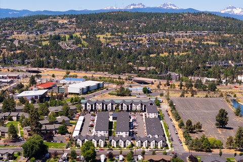A large building with a parking lot in front of it.