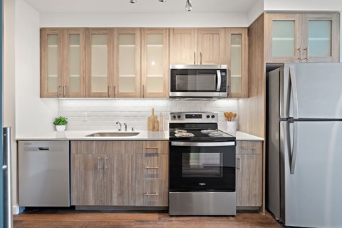 A modern kitchen with a refrigerator on the right.