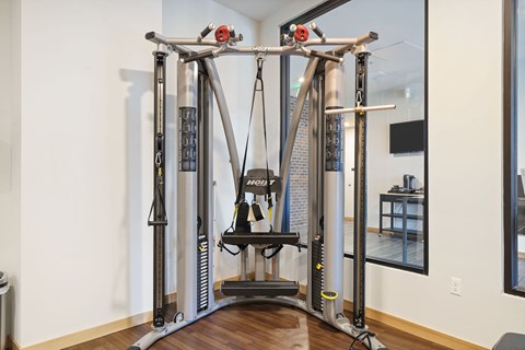 A home gym with a large piece of exercise equipment.