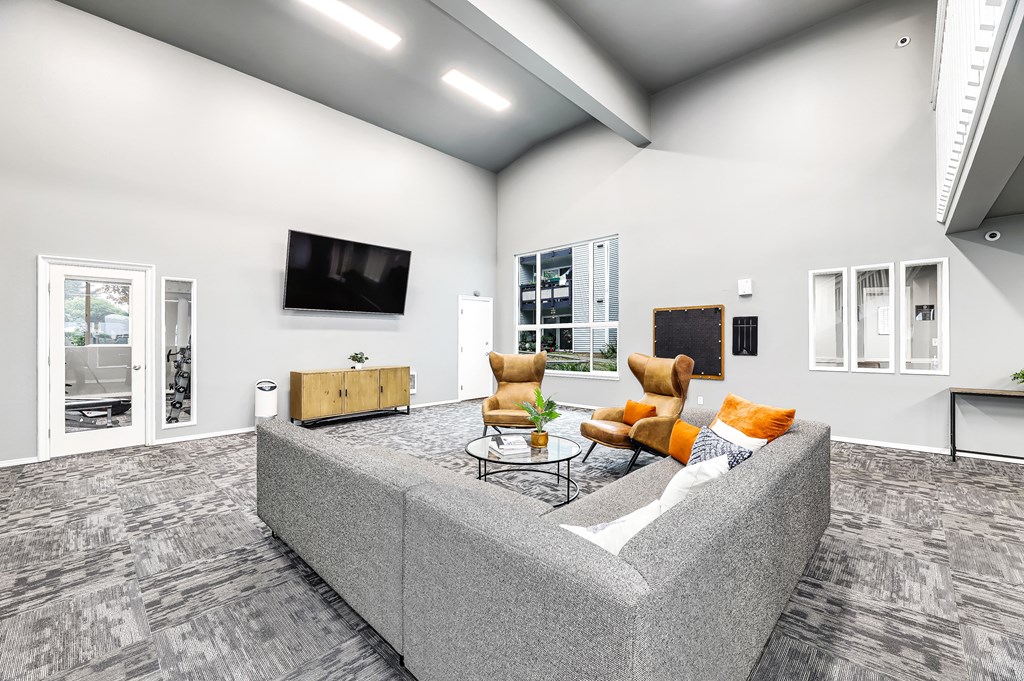 a living room with a couch and a tv