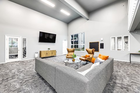 a living room with a couch and a tv