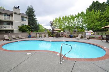 A small pool with a ladder in the middle of it.