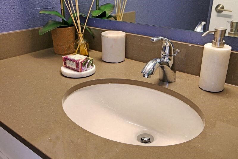 a bathroom sink with soap and a faucet on it