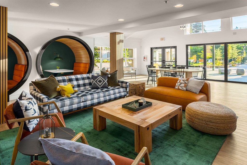 a living room with couches and chairs and a table