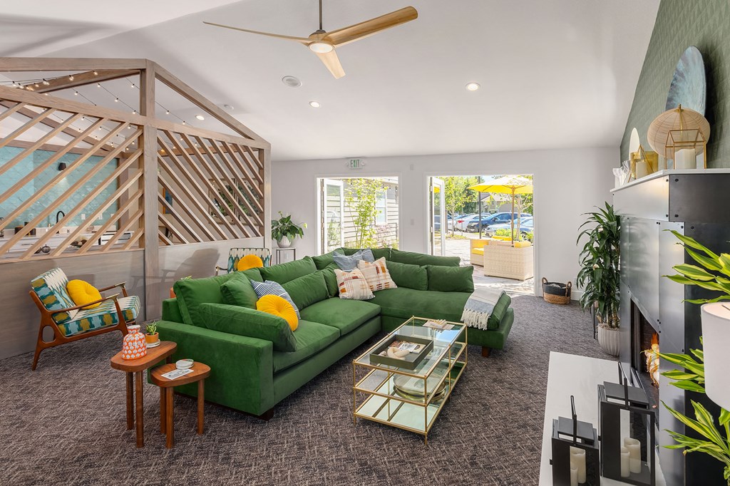 a living room with a green couch