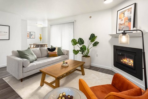 a living room with a couch and a fireplace