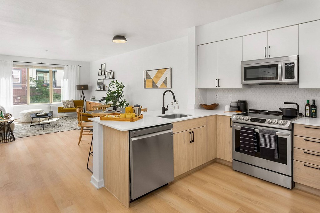 a kitchen with an island and a stove and a microwave