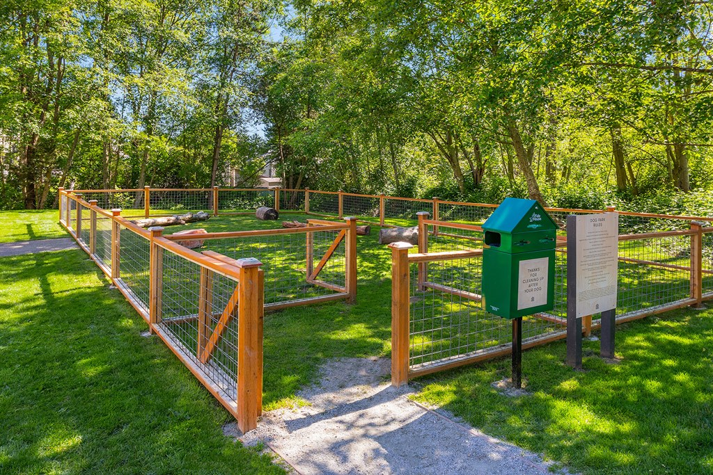 a fenced in area with a fence and a mailbox
