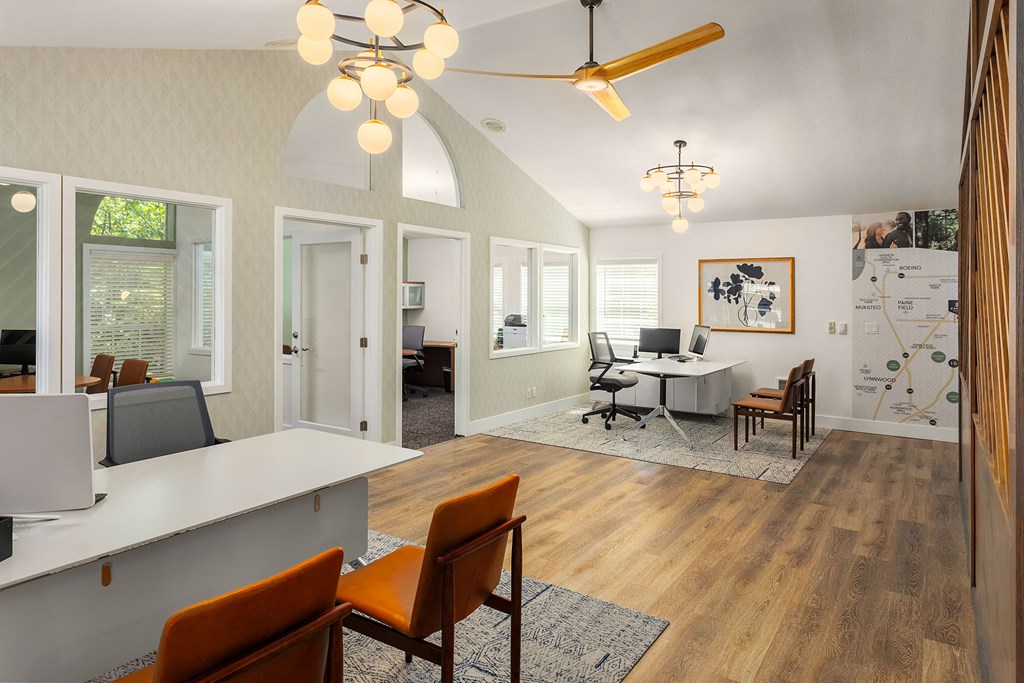 a living room and dining room with a table and chairs