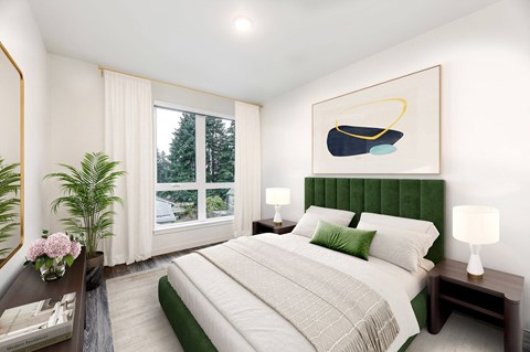 a bedroom with a bed and a large window