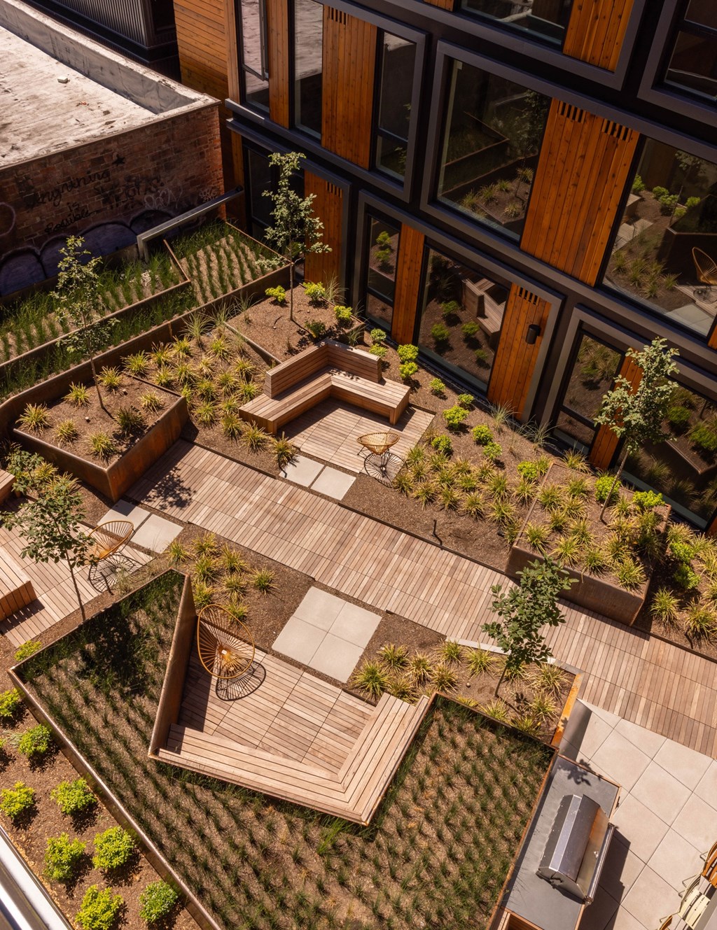 a view of a garden from the top of a building