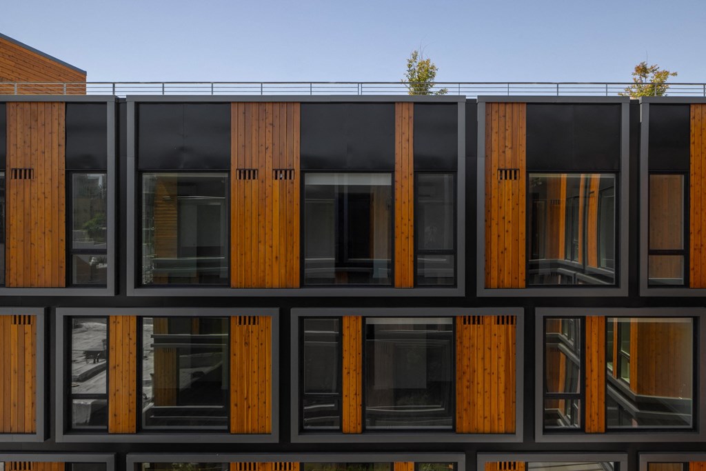 a reflection of a building in the windows of another building