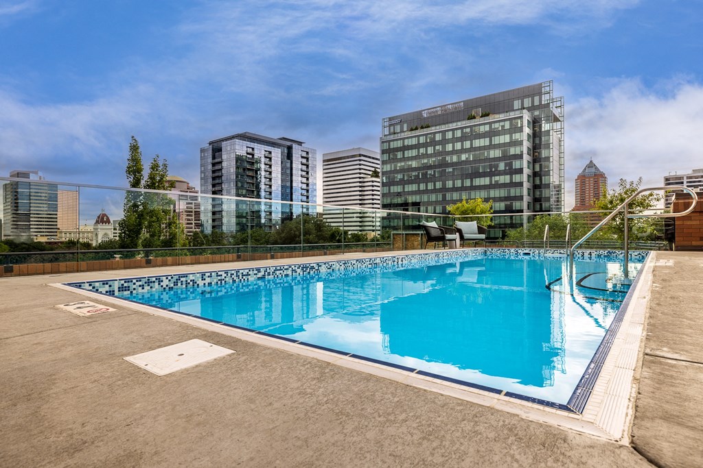 the pool on the rooftop of a building in the city