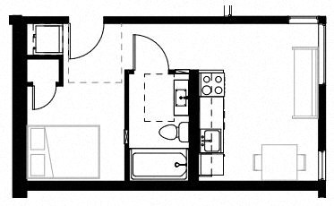 a room with a refrigerator and a stove in it