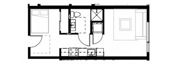 a room with a bed a sink and a mirror