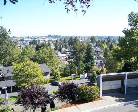 A view of a residential area with houses and trees.