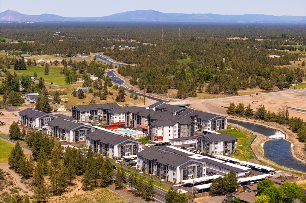 A large residential complex with a river running through it.