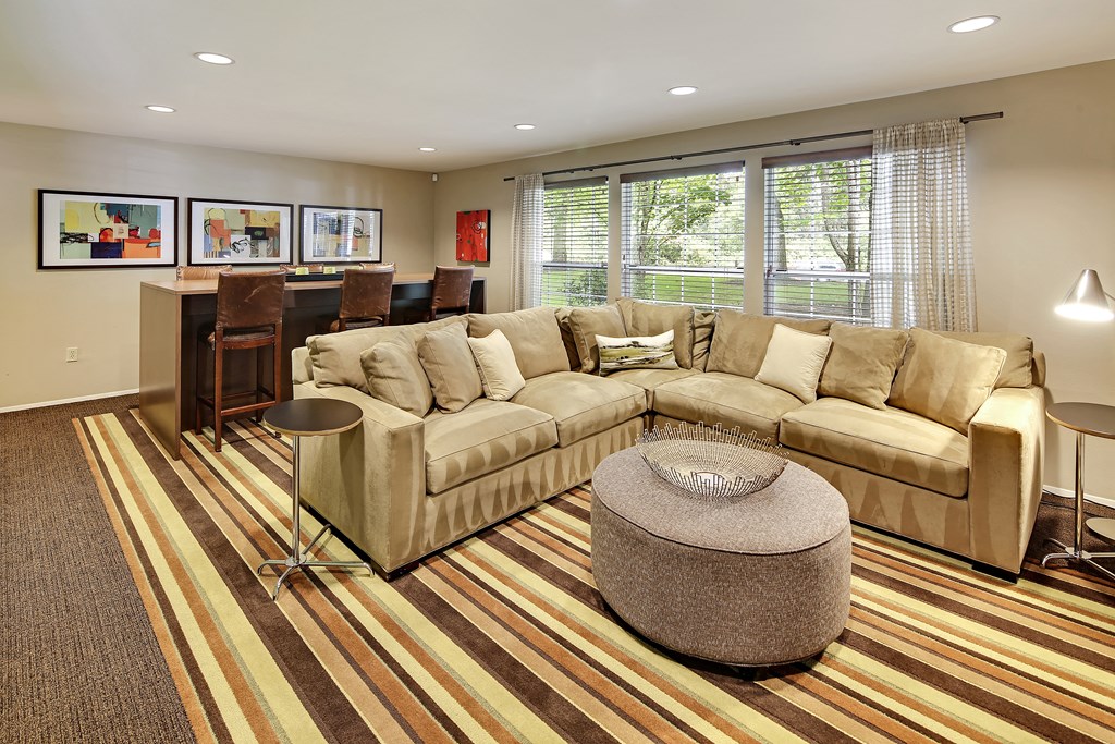 a living room with a couch and a table