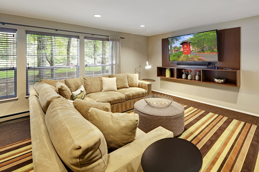 a large living room with a large couch and a television