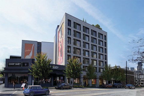 A modern building with a large advertisement on the side.