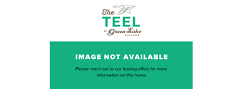 the green lake village logo with a fish on a green background