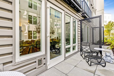 A patio with a table and chairs is shown.