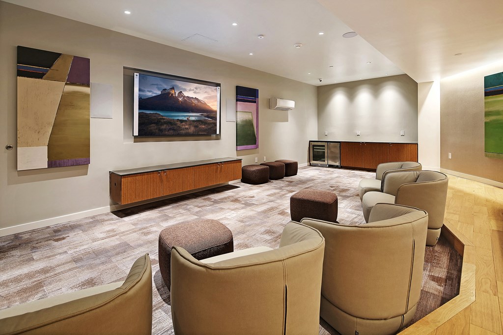 a large room with chairs and a projector screen