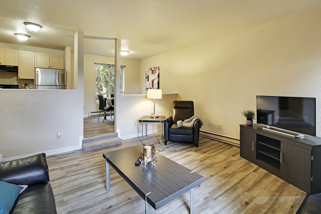 a living room with a tv and a table