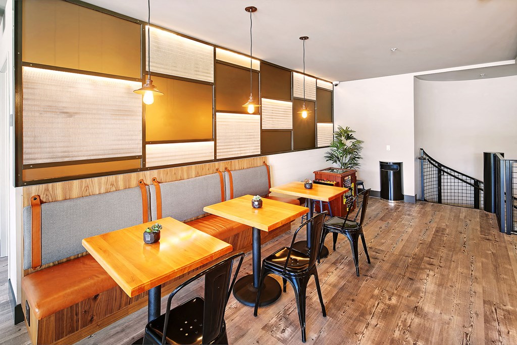 a restaurant with wooden tables and chairs