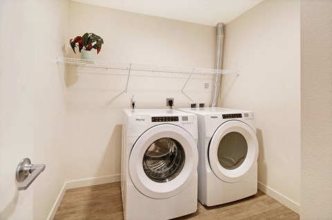 a washer and dryer in a laundry room with a