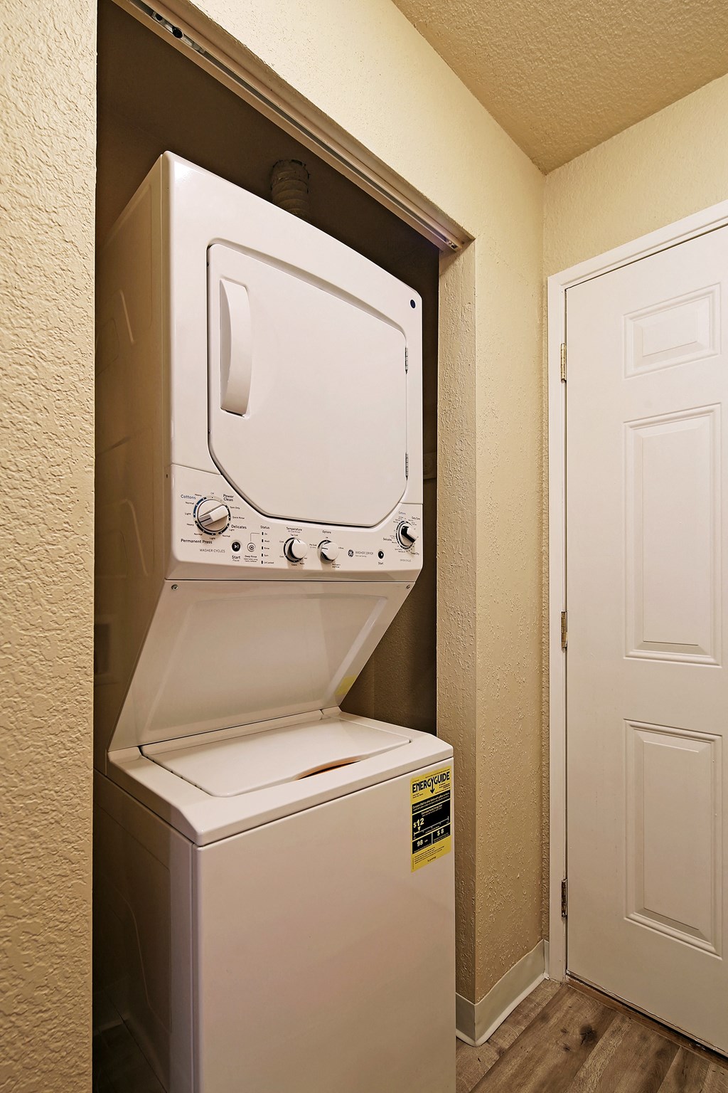 a washer and dryer in a room with a door